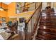 Bright, two-story living room with staircase and hardwood floors provides comfort and style at 290 Leigh Kay Dr, Lawrenceville, GA 30046