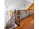 Well-lit staircase with hardwood steps and decorative railing creates an inviting atmosphere at 290 Leigh Kay Dr, Lawrenceville, GA 30046