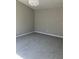 Bedroom with neutral paint, updated carpeting and decorative lighting at 295 Laurelton Cir, Lawrenceville, GA 30044