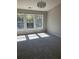 Spacious bedroom with natural light from three large windows and neutral carpeting at 295 Laurelton Cir, Lawrenceville, GA 30044
