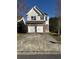 Beautiful two story home with brick and vinyl siding, along with an attached two-car garage at 295 Laurelton Cir, Lawrenceville, GA 30044