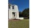 Exterior view of the house with siding, brick, landscaping, and a well-maintained lawn at 295 Laurelton Cir, Lawrenceville, GA 30044