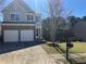 Charming two-story home featuring a brick facade and attached two-car garage at 295 Laurelton Cir, Lawrenceville, GA 30044