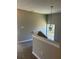 Second floor hallway features neutral paint, updated carpet, and decorative lighting at 295 Laurelton Cir, Lawrenceville, GA 30044