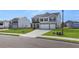 Two-story home boasts a two-car garage, gray siding, and manicured lawn in a vibrant neighborhood at 621 Kimberwick Dr, Locust Grove, GA 30248