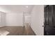 This is a view of a newly constructed living room featuring beautiful flooring and plenty of space at 621 Kimberwick Dr, Locust Grove, GA 30248