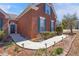 Well-manicured front exterior of a brick home with walkway lights and tasteful landscaping at 748 Chanson Sw Dr, Marietta, GA 30064