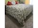 Comfortable bedroom with floral bedding and neutral carpet at 2490 Laurel Nw Cir, Atlanta, GA 30311