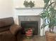 Cozy living room featuring a fireplace, perfect for relaxation and peace at 2490 Laurel Nw Cir, Atlanta, GA 30311