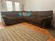 Spacious living area featuring a comfortable sectional sofa with hardwood flooring at 2490 Laurel Nw Cir, Atlanta, GA 30311