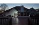 View of the back of the home from the deck, featuring a screened-in porch and well-maintained exterior at 460 Greystone Ln, Douglasville, GA 30134