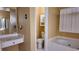 This bathroom features a separate tub and vanity area and a private toilet room at 460 Greystone Ln, Douglasville, GA 30134