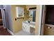 Bathroom with a sink vanity and white cabinet with blue flower accents at 460 Greystone Ln, Douglasville, GA 30134