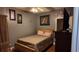 Bedroom with wood floors, gray walls, and furniture at 460 Greystone Ln, Douglasville, GA 30134