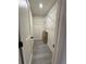 Walk-in closet with wire shelving and light gray wood floors at 596 Windchase Ln, Stone Mountain, GA 30083