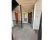Apartment exterior entrance featuring a secure metal gate door and house number at 596 Windchase Ln, Stone Mountain, GA 30083