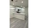 Bright and airy kitchen with white cabinetry, quartz countertops, and modern pendant lighting at 596 Windchase Ln, Stone Mountain, GA 30083