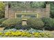 Landscaped entrance sign for Windchase Condominiums surrounded by colorful flowerbeds at 596 Windchase Ln, Stone Mountain, GA 30083
