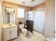Bathroom featuring a single vanity, toilet, and shower at 1490 Highland Lake Dr, Lawrenceville, GA 30045