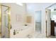 Bright bathroom featuring a shower, soaking tub, and tile flooring at 1490 Highland Lake Dr, Lawrenceville, GA 30045