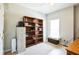 Bedroom with bookshelves, storage, and a window seat at 1490 Highland Lake Dr, Lawrenceville, GA 30045