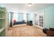 Bright bedroom featuring a daybed, desk, and french doors at 1490 Highland Lake Dr, Lawrenceville, GA 30045