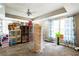 Bonus room with fan, curtains, and a large array of shelving units at 1490 Highland Lake Dr, Lawrenceville, GA 30045