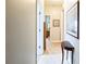 Hallway featuring neutral walls, carpeted flooring, and decorative furniture at 1490 Highland Lake Dr, Lawrenceville, GA 30045