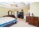 Spacious main bedroom with carpet, trey ceilings, lots of windows and natural light, and a king-size bed at 1490 Highland Lake Dr, Lawrenceville, GA 30045