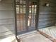 Exterior view of a back patio featuring a set of French doors and brick pavers at 285 Old College Way, Atlanta, GA 30328