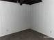 Unfinished basement space with gray carpeting and white paneled walls at 285 Old College Way, Atlanta, GA 30328