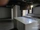 Modern basement kitchen featuring updated cabinets, an island and dark hardwood flooring at 285 Old College Way, Atlanta, GA 30328