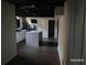 Modern basement kitchen featuring updated cabinets, an island and dark hardwood flooring at 285 Old College Way, Atlanta, GA 30328