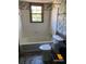 Full bathroom with tiled floors, a tub and shower combo, and black and white wallpaper at 285 Old College Way, Atlanta, GA 30328