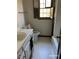 Bright bathroom featuring white fixtures and hexagon floor tiling at 285 Old College Way, Atlanta, GA 30328