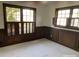 Bedroom with neutral carpet, dark trim, and natural light from large windows with shutters at 285 Old College Way, Atlanta, GA 30328