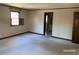 Spacious bedroom featuring neutral carpet, and a window, bathed in soft, natural light at 285 Old College Way, Atlanta, GA 30328