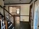 Inviting entryway features a stone floor, staircase, and clear view into the formal dining area at 285 Old College Way, Atlanta, GA 30328