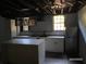 Modern kitchen with stainless steel appliances, island, and pendant lighting at 285 Old College Way, Atlanta, GA 30328