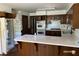 The kitchen includes white countertops, double ovens, and wood cabinetry at 285 Old College Way, Atlanta, GA 30328