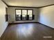 Spacious living room with hardwood floors, ample natural light, and classic trim at 285 Old College Way, Atlanta, GA 30328