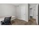 Bedroom with neutral walls, carpet, ensuite bathroom access, and closet at 401 Woodcliff Dr, Atlanta, GA 30350