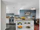 Kitchen and dining area with sleek stainless steel appliances and modern cabinetry at 401 Woodcliff Dr, Atlanta, GA 30350