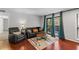 Inviting living room featuring hardwood floors and access to outdoor balcony at 401 Woodcliff Dr, Atlanta, GA 30350