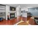 Bright living room with fireplace and a view into the kitchen at 401 Woodcliff Dr, Atlanta, GA 30350