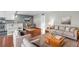 Open-concept living area featuring hardwood floors, modern decor, and comfortable seating at 401 Woodcliff Dr, Atlanta, GA 30350