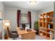 Bright office with built-in shelving, desk, and natural light at 401 Woodcliff Dr, Atlanta, GA 30350