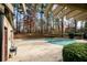 A view of the community's outdoor pool covered during the off-season with tall surrounding trees at 401 Woodcliff Dr, Atlanta, GA 30350
