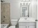 Well-lit bathroom with a shower, tub, and a vanity with sink, offering functionality and comfort at 4718 Wehunt Se Trl # 20, Smyrna, GA 30082