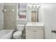 Well-lit bathroom with a combined tub and shower, a vanity with storage, and a window for natural light at 4718 Wehunt Se Trl # 20, Smyrna, GA 30082